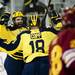 Michigan sophomore left wingman Alex Guptill celebrates junior right wingman Derek DeBlois' goal in the first period of the game against Ferris State on Friday, Mar. 1. Michigan won 4-1. Daniel Brenner I AnnArbor.com